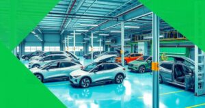 A modern electric vehicle assembly plant showcasing eco-friendly technology and teamwork in an industrial setting.