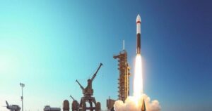 A military rocket on a test launch pad against a clear sky, symbolizing international tensions and defense readiness.
