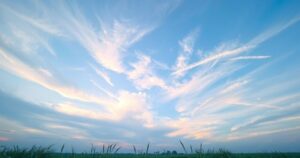Partly cloudy evening sky over a landscape with cool temperatures, perfect for welcoming hurricane season.
