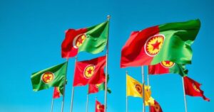 Kurdish flags waving during a significant political gathering advocating for peace and democracy in the region.